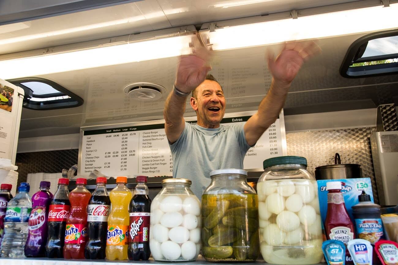 David welcoming customers from the van hatch, with jars of pickled eggs, onions and gherkins