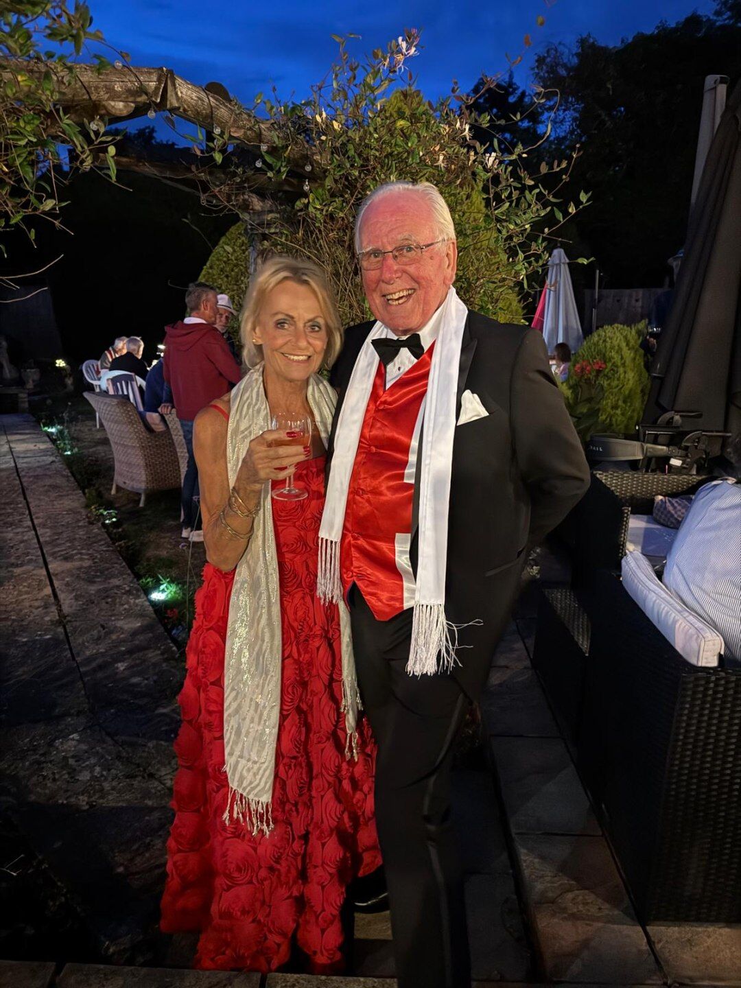 Keith and Pam dressed up at Keith's 75th birthday garden party, catered by DB's Fish & Chips