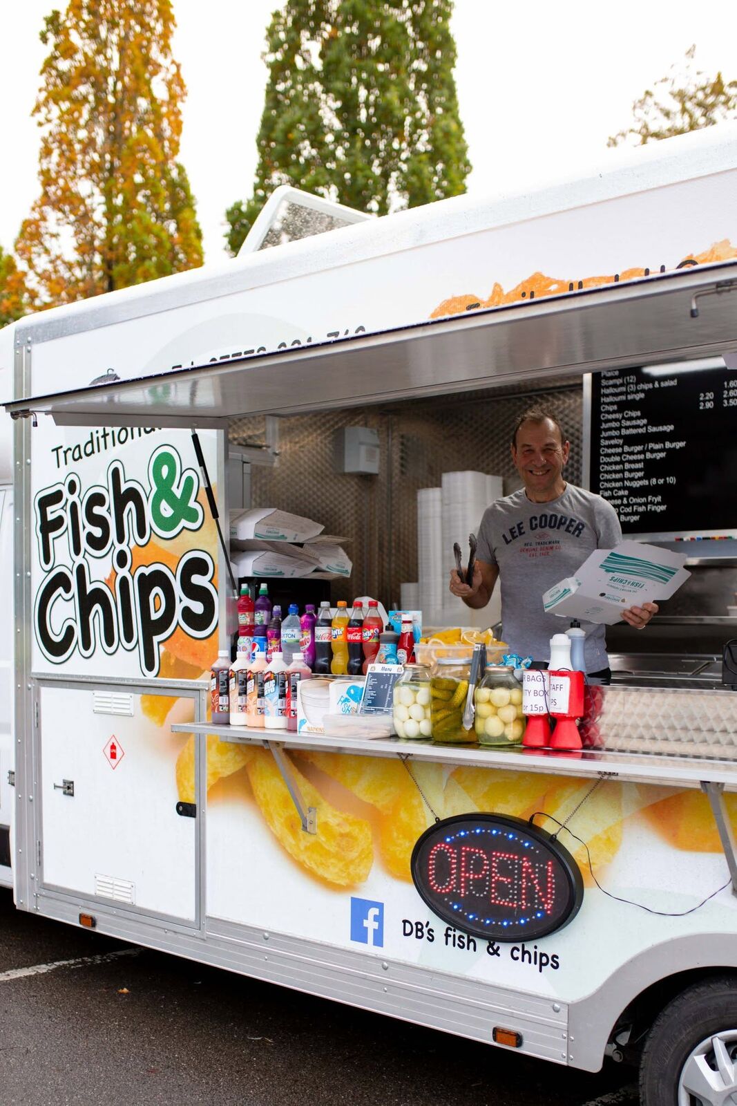 David at the serving hatch of the DB's traditional fish and chip van, with pickled eggs, gherkins and sauces on the counter